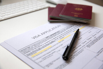 Close up of a visa application document with a German passport