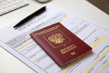 Close up of a visa application document with a Russian passport