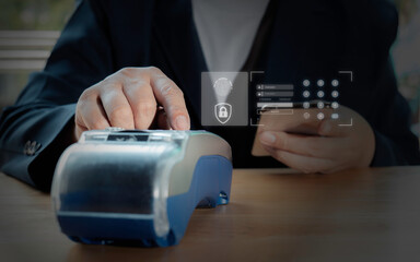 Businessman using EDC (Electronic Data Capture) and login for payment online shopping product, Involved in mobile shopping at home, purchasing goods or services in internet store.