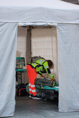 Outside White Temporary Rescue Control Centre Tent with a Doctor