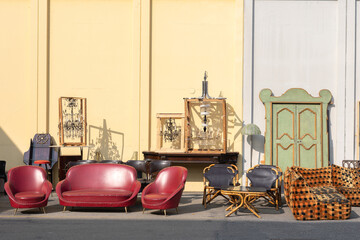 Antique Wooden Stuffed - Furniture, Cabinets, Sofas, Chairs and Mirrors Leaning Outside on the Street