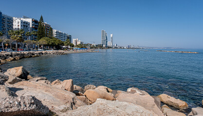 View of Limassol beach and the frontline of buildings and skyscrapers along the promenade park and coast, Limassol, Cyprus - obrazy, fototapety, plakaty