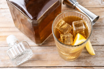 Highball, Whiskey with soda and lemon beverage on wooden table. Top view