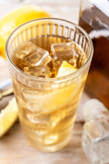 Highball, Whiskey with soda and lemon beverage on wooden table