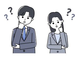 首を傾げるスーツ姿の男性と女性