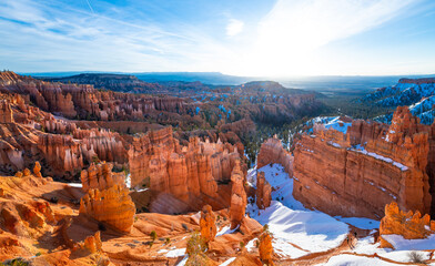Wide angle panorama backlight shot of Bryce Canyon National Park on a cold winter morning after...
