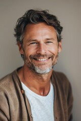 Fototapeta premium Close-up of a cheerful middle-aged man with a beard, radiating confidence