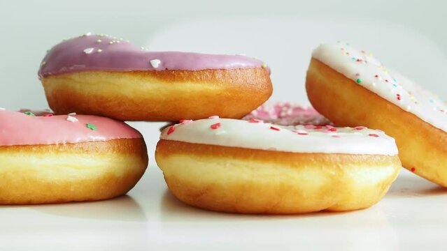 Background with donuts close-up. Trendy, national dessert. Harmful high-calorie foods. Obesity problems. The concept of a healthy lifestyle and balanced nutrition. Fry in oil. cholesterol food. June 7