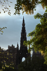 Monument to Walter Scott in Edinburgh framed by tree branches, Scotland, UK