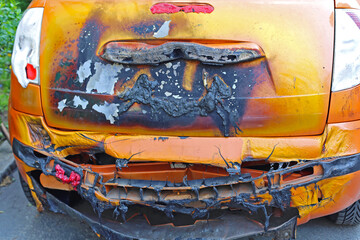 Melted and Dameged Car After Fire Inferno Rear View
