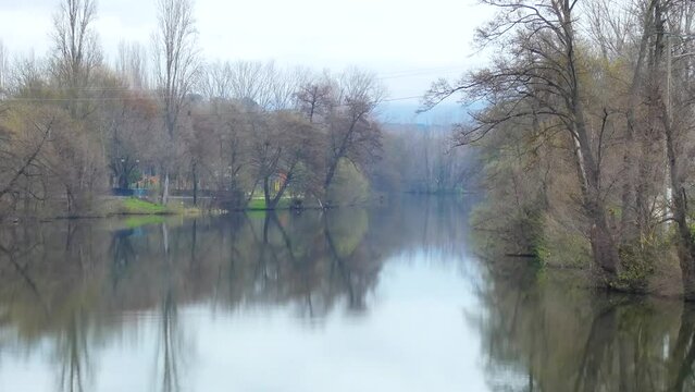 Plasencia, Spain - February 21, 2024 - View of the Jerte River as it passes through the city of Plasencia, in the park that forms the island of the city