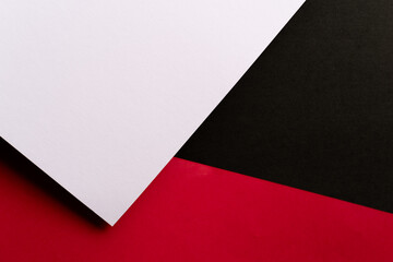 赤と黒と白の重なった画用紙の背景 - obrazy, fototapety, plakaty