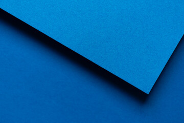 重なる青色の画用紙の背景 - obrazy, fototapety, plakaty
