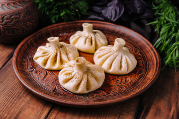 Georgian khinkali on traditional plate