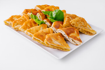 Fresh baked puff pastry assortment on white plate
