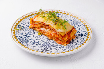 Fresh homemade lasagna on ornate plate