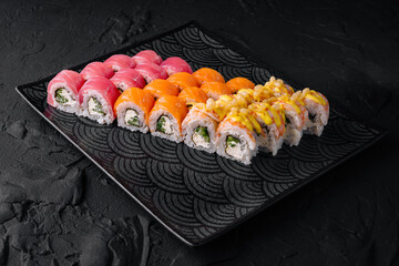 Assorted sushi set on black plate