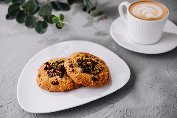 Gourmet cookies and latte on elegant tabletop