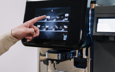 Choosing coffee options on a modern touchscreen machine