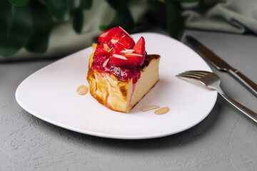 Fototapeta premium Gourmet berry cheesecake slice on elegant plate