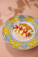 Colorful bowl of oatmeal with fresh fruits