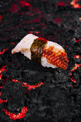 Gourmet sushi on lava background