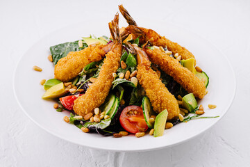 Crispy breaded shrimp salad with fresh vegetables