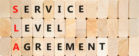 SLA service level agreement symbol. Concept words SLA service level agreement on beautiful wooden...