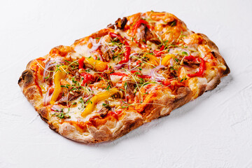 Fresh gourmet vegetable pizza on white background