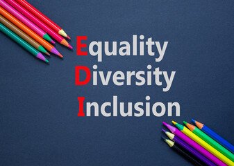 EDI equality diversity inclusion symbol. Concept words EDI equality diversity inclusion. Beautiful black background. Colored pencils. Business EDI equality diversity inclusion concept. Copy space.