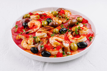 Appetizing seafood platter on white plate