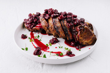 Roasted pork tenderloin with cherry sauce