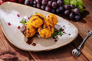 Gourmet fried ice cream scoops on elegant plate