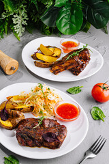 Barbecue ribs with garnish on elegant plates