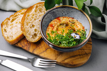 Gourmet hummus with artisan bread and edible flower