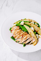 Fresh grilled chicken salad with pear and feta cheese
