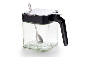 Empty glass condiment jar with spoon on white background, Food containers for salt, pepper or sugar