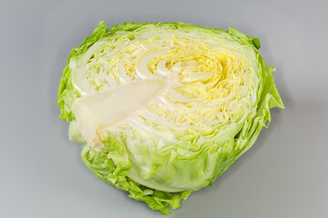 Half of young white cabbage head on a gray background - 787046177