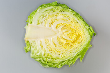Half of young white cabbage on gray background, top view - 787046193