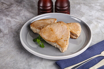 Roasted red tuna steak in the plate