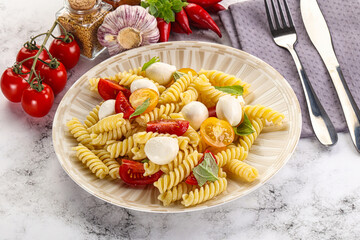 Italian pasta with mozzarella and tomato