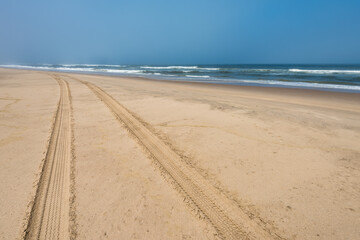 Car tire tracks in the sand of Skeleton Coast, Namibia - 787050594