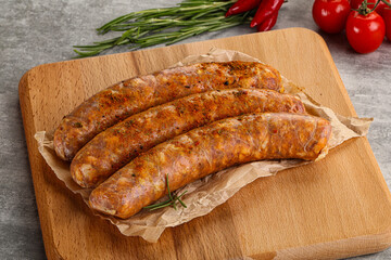 Raw sausages with spices and herbs