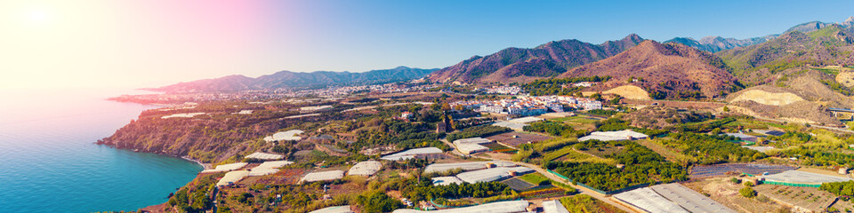Panoramic view of the sea of greenhouses. Greenhouses in the south of Spain near Maro city, Nerja,...
