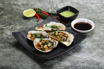 Open half oysters with green onion