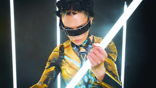 fantasy woman warrior fashion model posing with light rays lasers digital cyber smart glasses and steam punk accessories. Sexy Girl creative clothes costume in steampunk style concept future, video 4k