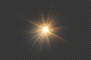 A flash of light and sun rays. Light glare of a star and twinkle. On a transparent background.