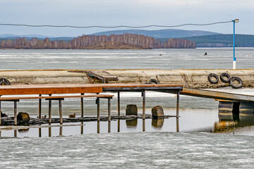 An empty river pier on a spring day