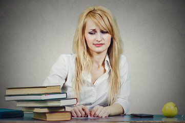 Portrait of a student unhappy with a big assignment at school  - 787063169