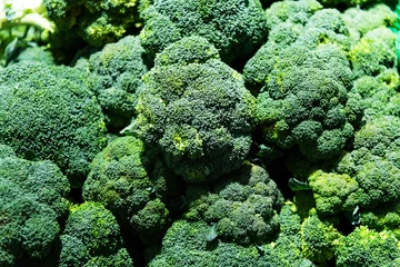 Plexiglas foto achterwand Pile of fresh broccoli in market © xy